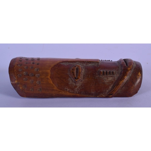 300 - AN EARLY 20TH CENTURY AFRICAN CARVED TRIBAL MASK with sparse decoration. 12 cm x 5 cm.