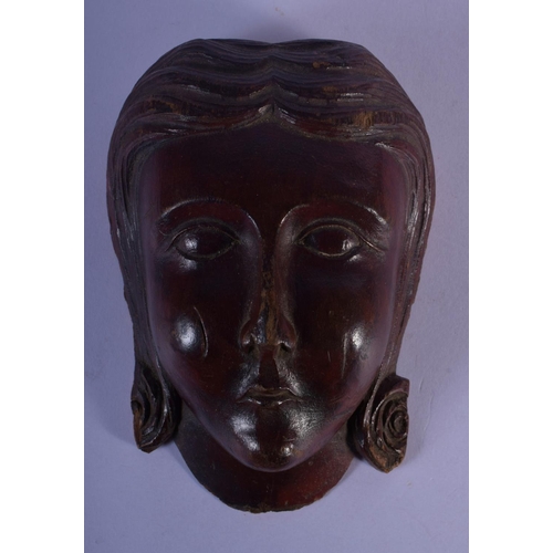 301 - AN 18TH CENTURY EUROPEAN CARVED TREEN WOOD MASK modelled as a female. 12 cm x 7 cm.
