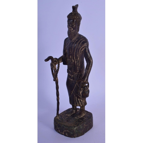 302 - AN 18TH/19TH CENTURY MIDDLE EASTERN BRONZE FIGURE OF A MALE modelled holding a teapot and staff. 24 ... 