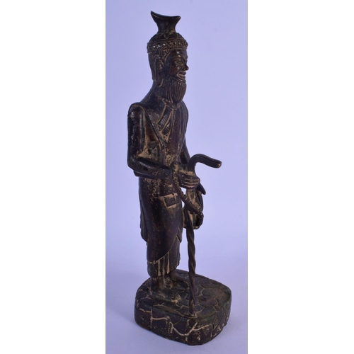 302 - AN 18TH/19TH CENTURY MIDDLE EASTERN BRONZE FIGURE OF A MALE modelled holding a teapot and staff. 24 ... 