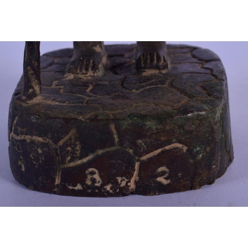 302 - AN 18TH/19TH CENTURY MIDDLE EASTERN BRONZE FIGURE OF A MALE modelled holding a teapot and staff. 24 ... 