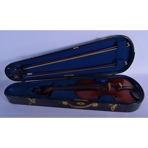 306 - A 19TH CENTURY GERMAN VIOLIN with two bows and contained within an Edward Withers case. 58 cm long. ... 