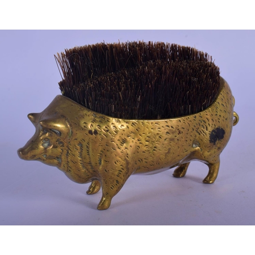 312 - AN EARLY VICTORIAN BRASS PEN PIG WIPE. 10 cm wide.