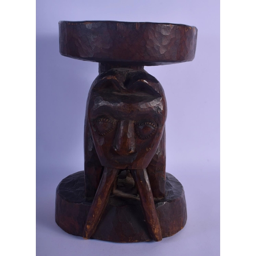 315 - A LARGE VINTAGE AFRICAN TRIBAL CARVED WOOD STOOL formed as a long tusked animal. 32 cm x 22 cm.