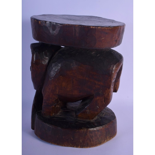 315 - A LARGE VINTAGE AFRICAN TRIBAL CARVED WOOD STOOL formed as a long tusked animal. 32 cm x 22 cm.