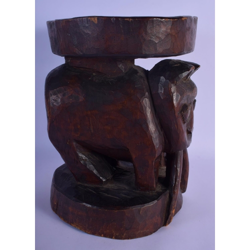 315 - A LARGE VINTAGE AFRICAN TRIBAL CARVED WOOD STOOL formed as a long tusked animal. 32 cm x 22 cm.