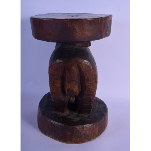 315 - A LARGE VINTAGE AFRICAN TRIBAL CARVED WOOD STOOL formed as a long tusked animal. 32 cm x 22 cm.