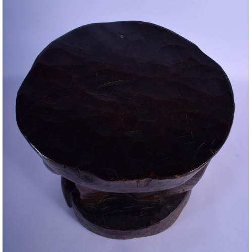 315 - A LARGE VINTAGE AFRICAN TRIBAL CARVED WOOD STOOL formed as a long tusked animal. 32 cm x 22 cm.