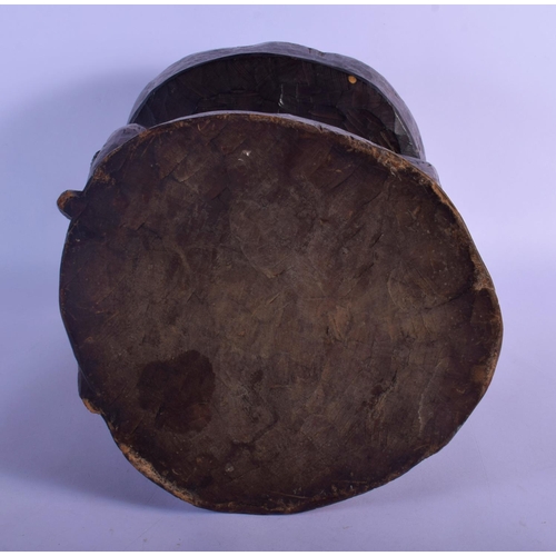 315 - A LARGE VINTAGE AFRICAN TRIBAL CARVED WOOD STOOL formed as a long tusked animal. 32 cm x 22 cm.