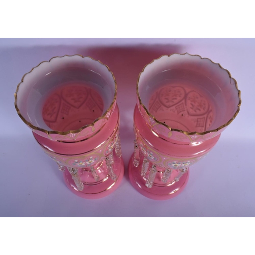 32 - A PAIR OF PINK ENAMELLED OPALINE GLASS LUSTRES. 38 cm x 15 cm.