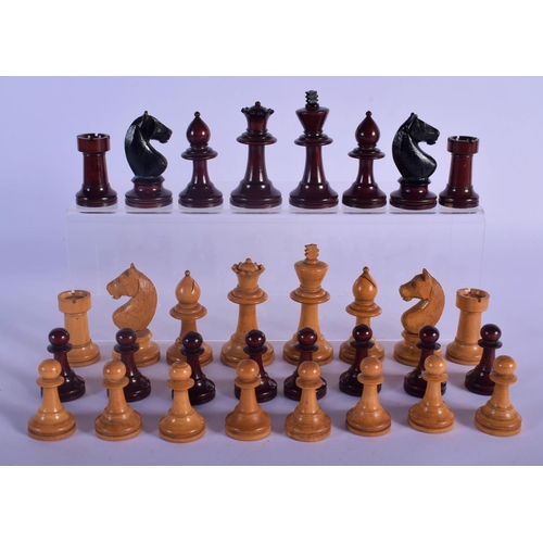320 - AN EARLY 20TH CENTURY BOXWOOD AND CARVED WOOD CHESS SET. Largest piece 8 cm high. (qty)