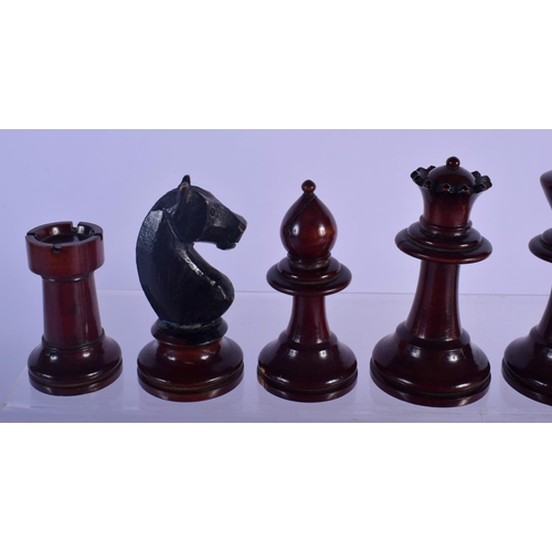 320 - AN EARLY 20TH CENTURY BOXWOOD AND CARVED WOOD CHESS SET. Largest piece 8 cm high. (qty)