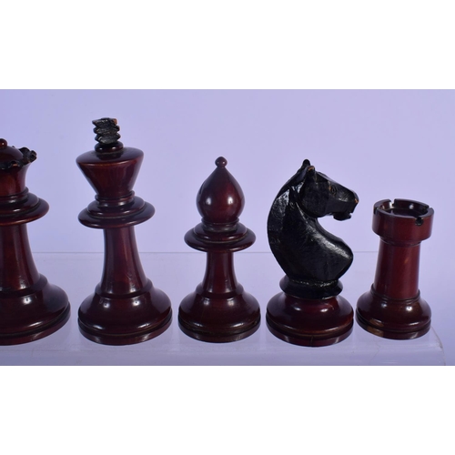 320 - AN EARLY 20TH CENTURY BOXWOOD AND CARVED WOOD CHESS SET. Largest piece 8 cm high. (qty)