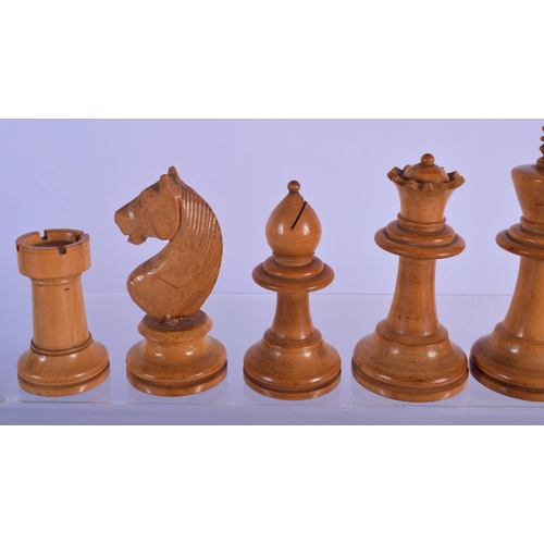 320 - AN EARLY 20TH CENTURY BOXWOOD AND CARVED WOOD CHESS SET. Largest piece 8 cm high. (qty)