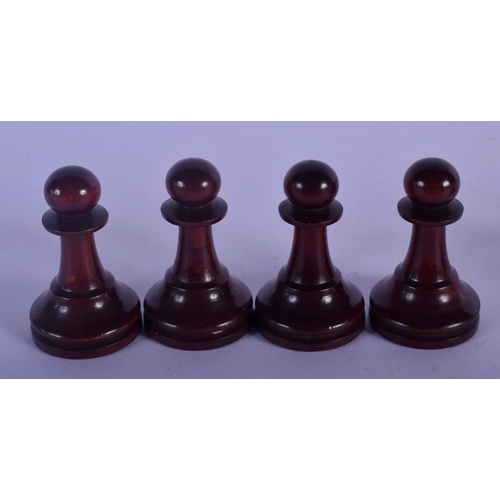 320 - AN EARLY 20TH CENTURY BOXWOOD AND CARVED WOOD CHESS SET. Largest piece 8 cm high. (qty)