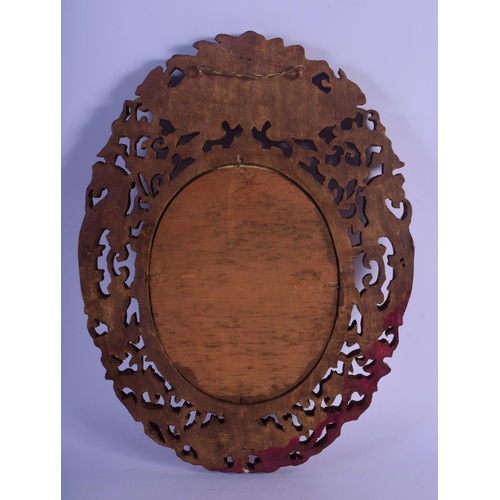 324 - A 19TH CENTURY INDIAN MIDDLE EASTERN CARVED SANDALWOOD FRAME decorated with flowers and vines. 30 cm... 