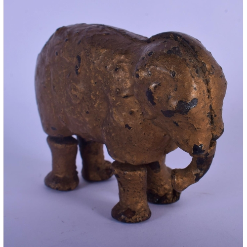 326 - AN ANTIQUE CAST IRON FIGURE OF JUMBO THE ELEPHANT. 9 cm x 7 cm.