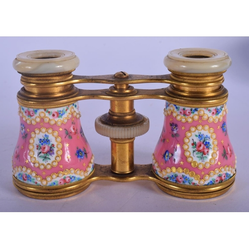 329 - A PAIR OF EARLY 20TH CENTURY EUROPEAN ENAMELLED OPERA GLASSES painted with flowers. 9 cm x 7 cm exte... 
