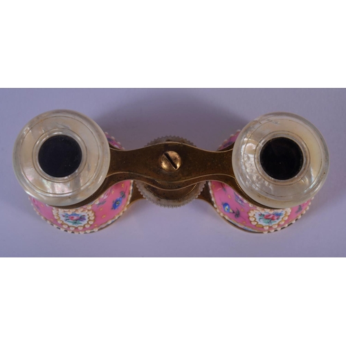 329 - A PAIR OF EARLY 20TH CENTURY EUROPEAN ENAMELLED OPERA GLASSES painted with flowers. 9 cm x 7 cm exte... 