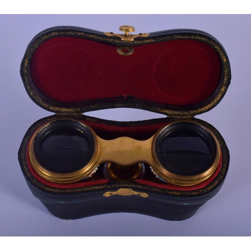 329 - A PAIR OF EARLY 20TH CENTURY EUROPEAN ENAMELLED OPERA GLASSES painted with flowers. 9 cm x 7 cm exte... 