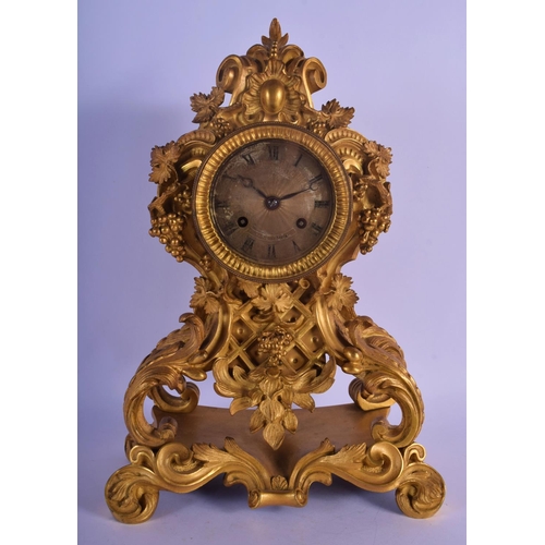 330 - A LOVELY 19TH CENTURY FRENCH ORMOLU MANTEL CLOCK overlaid with scrolling acanthus and hanging berrie... 
