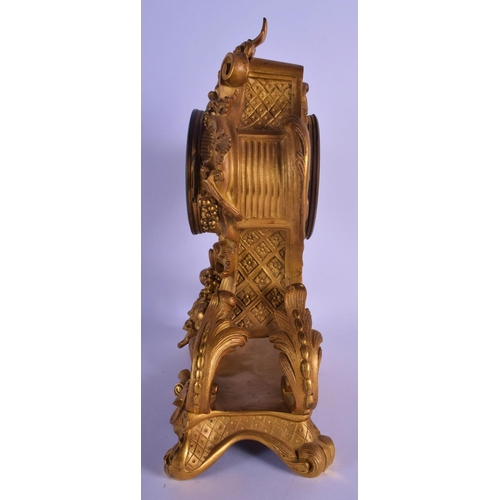 330 - A LOVELY 19TH CENTURY FRENCH ORMOLU MANTEL CLOCK overlaid with scrolling acanthus and hanging berrie... 