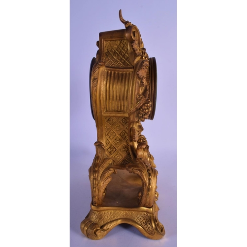 330 - A LOVELY 19TH CENTURY FRENCH ORMOLU MANTEL CLOCK overlaid with scrolling acanthus and hanging berrie... 