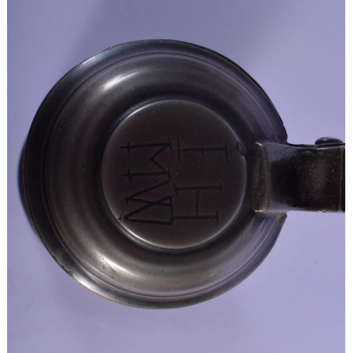 344 - A MID 19TH CENTURY PEWTER TANKARD and a tappit hen. Largest 25 cm high. (2)