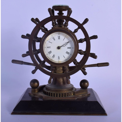 349 - A RARE 19TH CENTURY EUROPEAN INDUSTRIAL SHIPS WHEEL CLOCK with revolving base and inset barometer & ... 