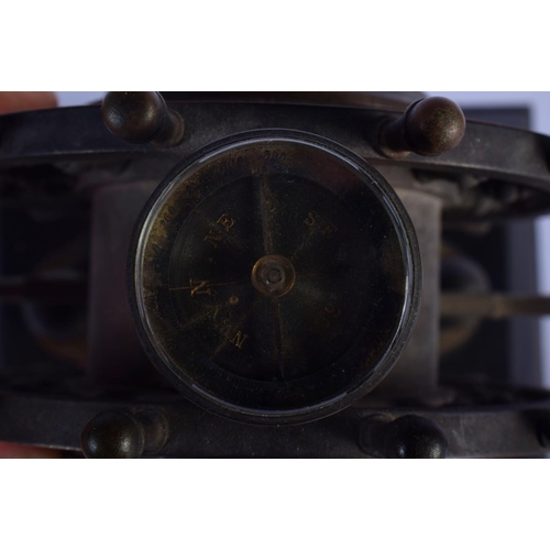 349 - A RARE 19TH CENTURY EUROPEAN INDUSTRIAL SHIPS WHEEL CLOCK with revolving base and inset barometer & ... 