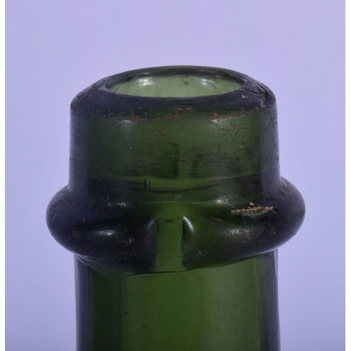 35 - AN EARLY BENEDICTINE GREEN GLASS BOTTLE. 24 cm high.