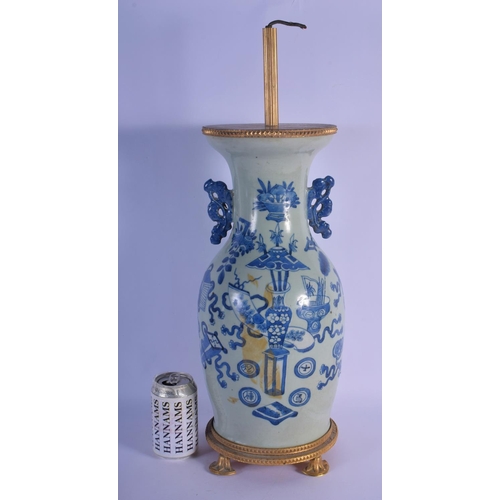 350 - A 19TH CENTURY CHINESE TWIN HANDLED BLUE AND WHITE CELADON VASE converted to a lamp, painted with fl... 