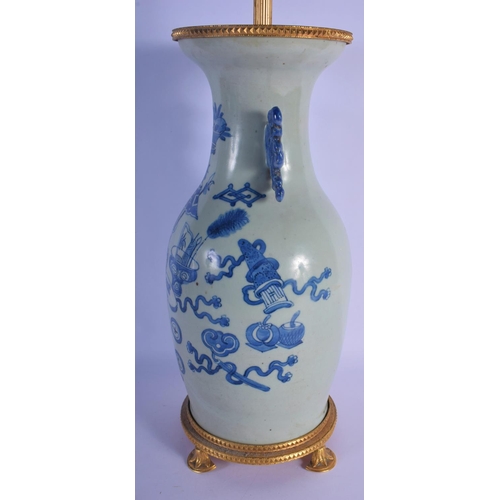 350 - A 19TH CENTURY CHINESE TWIN HANDLED BLUE AND WHITE CELADON VASE converted to a lamp, painted with fl... 
