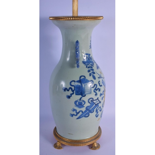 350 - A 19TH CENTURY CHINESE TWIN HANDLED BLUE AND WHITE CELADON VASE converted to a lamp, painted with fl... 