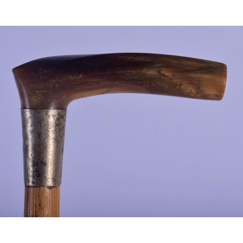 351 - A 19TH CENTURY MIDDLE EASTERN CARVED RHINOCEROS HORN HORSE RIDING CROP. 52 cm long.