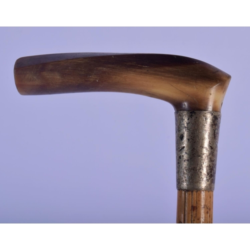 351 - A 19TH CENTURY MIDDLE EASTERN CARVED RHINOCEROS HORN HORSE RIDING CROP. 52 cm long.