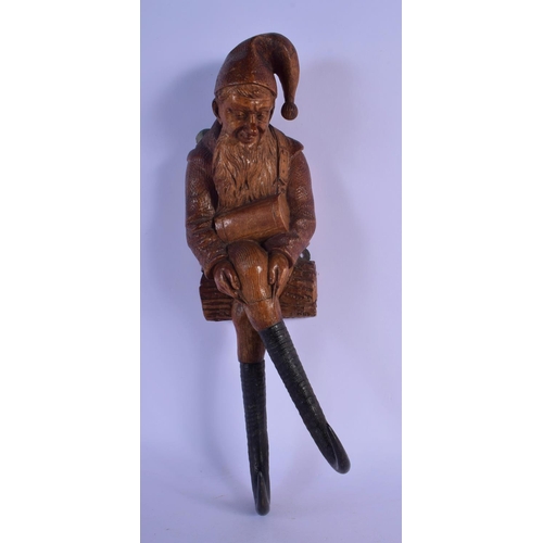 359 - A RARE 19TH CENTURY BAVARIAN BLACK FOREST GNOME COAT HOOK. 36 cm long.