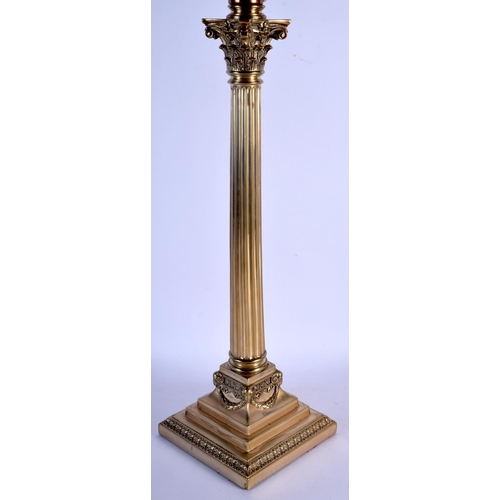 361 - AN ANTIQUE COUNTRY HOUSE SILVER PLATED CORINTHIAN COLUMN LAMP. 76 cm high inc shade.