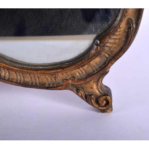 363 - A VINTAGE COUNTRY HOUSE GILTWOOD SCROLLING STRUT MIRROR. 52 cm x 42 cm.