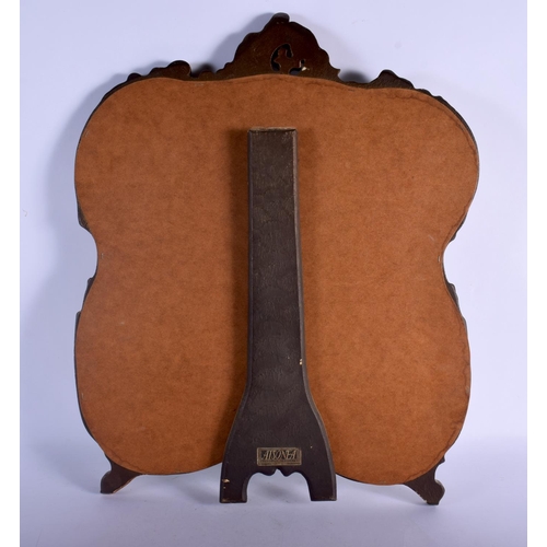 363 - A VINTAGE COUNTRY HOUSE GILTWOOD SCROLLING STRUT MIRROR. 52 cm x 42 cm.