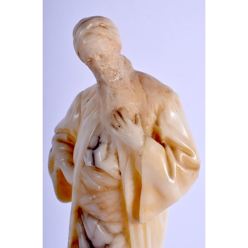 369 - A 19TH CENTURY ITALIAN CARVED ALABASTER FIGURE OF A MALE modelled clutching his beard. 29 cm high.