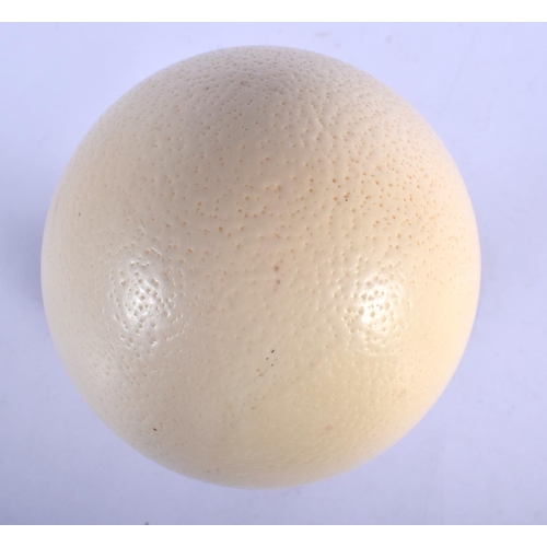 372 - A MOUNTED OSTRICH EGG. 25 cm high.