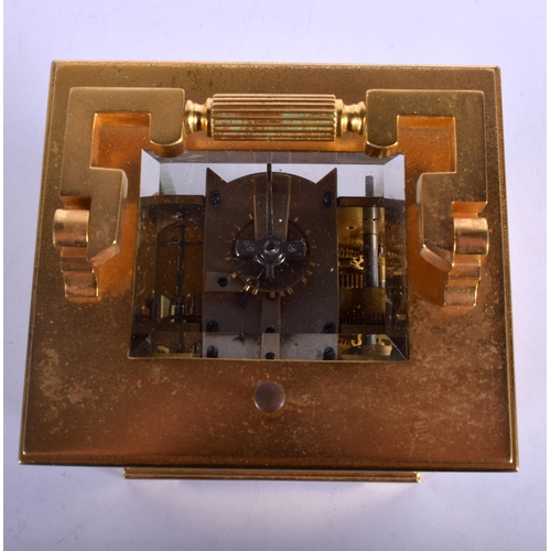 378 - AN ANTIQUE REPEATING BRASS CARRIAGE CLOCK with silver overlaid dial. 18 cm high inc handle.