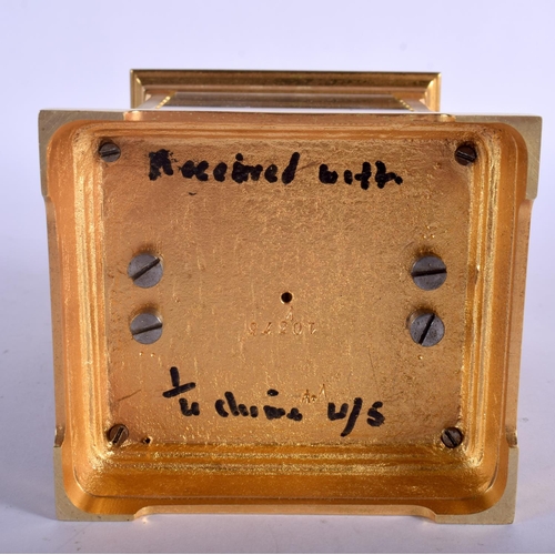 378 - AN ANTIQUE REPEATING BRASS CARRIAGE CLOCK with silver overlaid dial. 18 cm high inc handle.