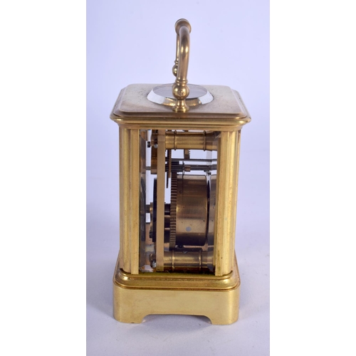 380 - A CASED MINIATURE ANTIQUE BRASS CARRIAGE CLOCK. 8.75 cm high inc handle.