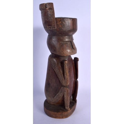 384 - AN UNUSUAL PAPUA NEW GUINEA CARVED TRIBAL WOOD FIGURE possibly Trobriand people. 36 cm high.