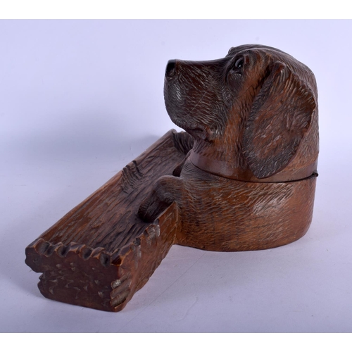 389 - A 19TH CENTURY BAVARIAN BLACK FOREST CARVED WOOD DESK STAND formed as a dog head with inkwell and pe... 