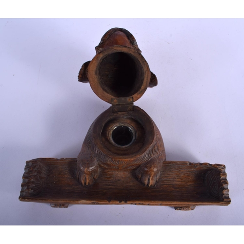 389 - A 19TH CENTURY BAVARIAN BLACK FOREST CARVED WOOD DESK STAND formed as a dog head with inkwell and pe... 