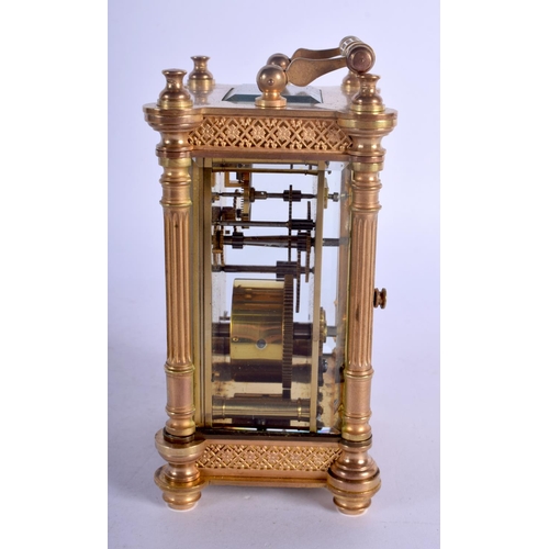 393 - A FRENCH BRASS CARRIAGE CLOCK with circular enamelled dial. 15 cm high.