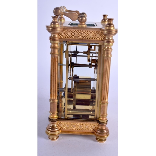 393 - A FRENCH BRASS CARRIAGE CLOCK with circular enamelled dial. 15 cm high.